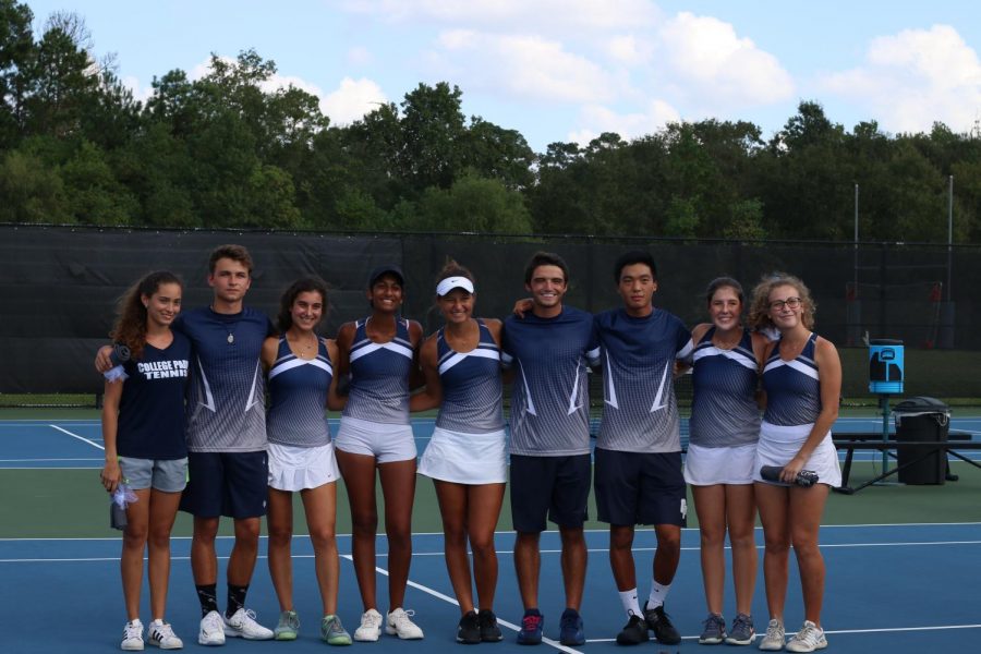 Members of the varsity tennis team pose for a picture after a successful tournament. 