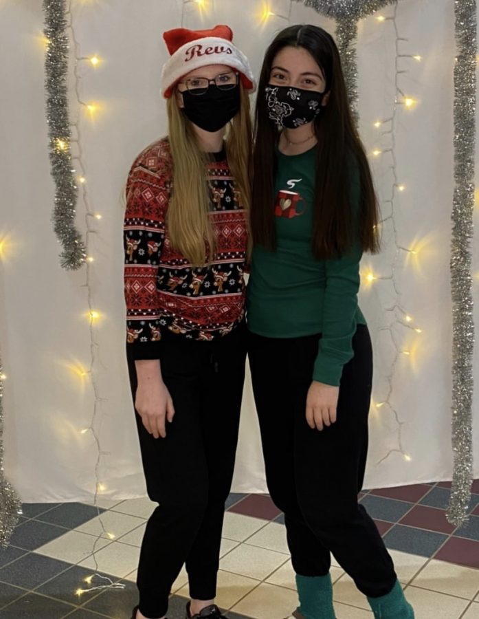 Revelier Officers, Caitlin Harwood and Emma Weixel at the Team's Holiday Party