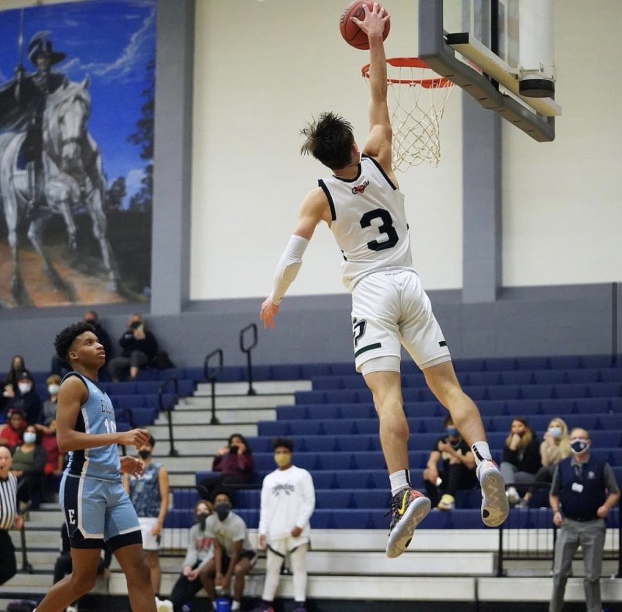 Drew Calderon (#3) dunking