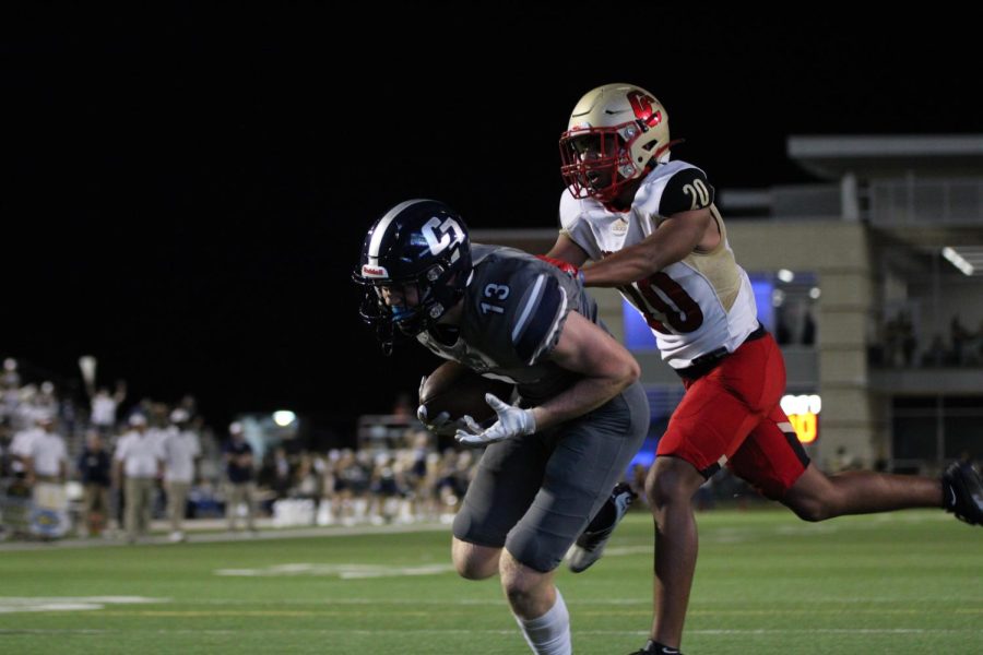 Bryce Anderson scores a touchdown against Caney Creek