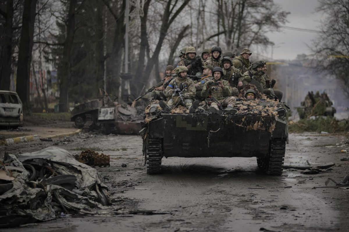 Ukrainian servicemen ride on a fighting vehicle outside Kyiv on Saturday. Russian forces are retreating from the capital's region as they turn their firepower to the south and east. (Vadim Ghirda/AP). Photo Courtesy of www.npr.org/2022/04/02/1090471297/russia-ukraine-war-what-happened-today-april-2